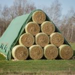 Round Bales in a Pyramid stack under a Toptex sheet